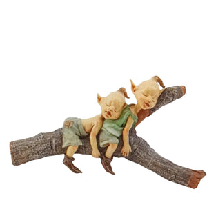 Two Elvins Sleeping On Log