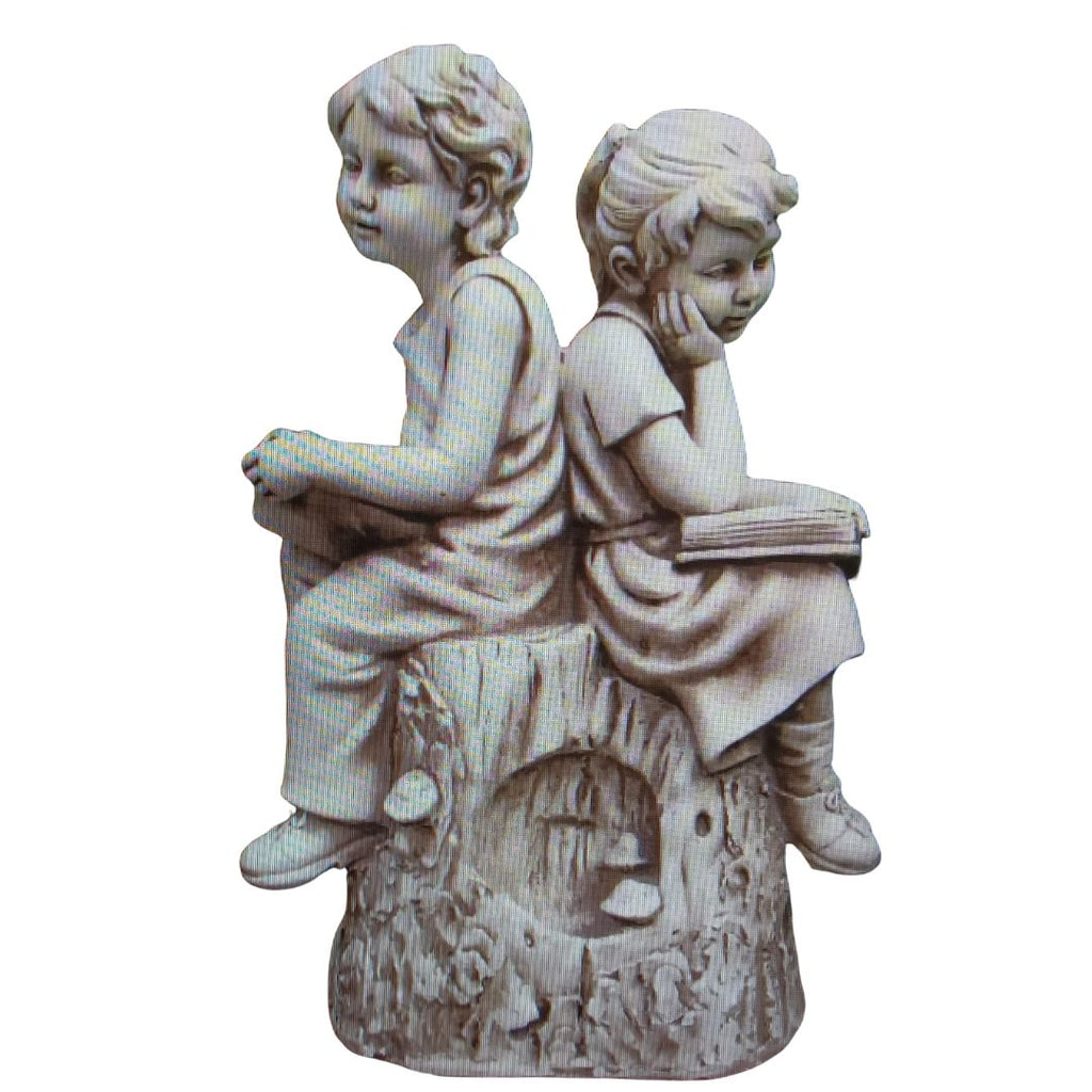 Boy And Girl Reading On Rock